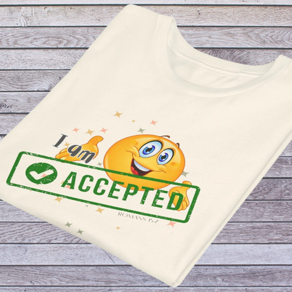 Natural colored t-shirt with emoji design and text 'I am accepted' on a wooden surface