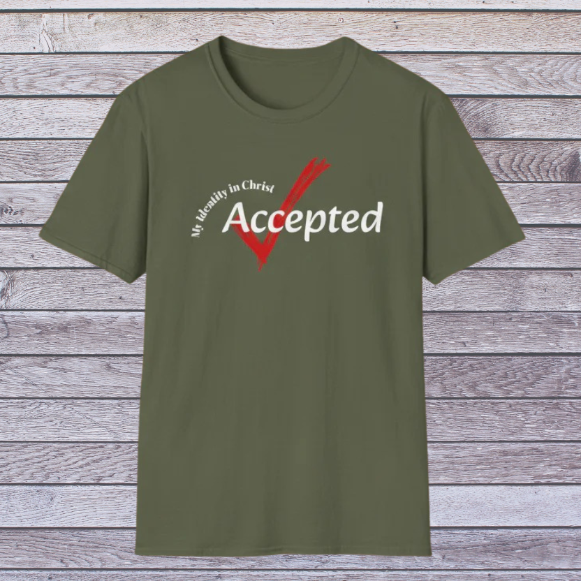 Green t-shirt with 'Accepted' text and red checkmark on a wooden background