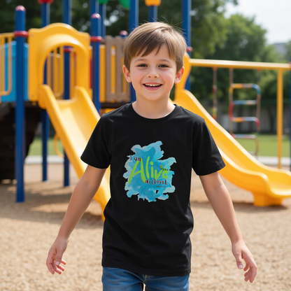 Child wearing a black t-shirt with a colorful Alive design at a playground.