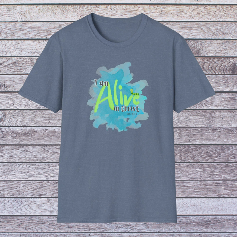 Indigo t-shirt with 'I am Alive in Christ' design on a wooden surface