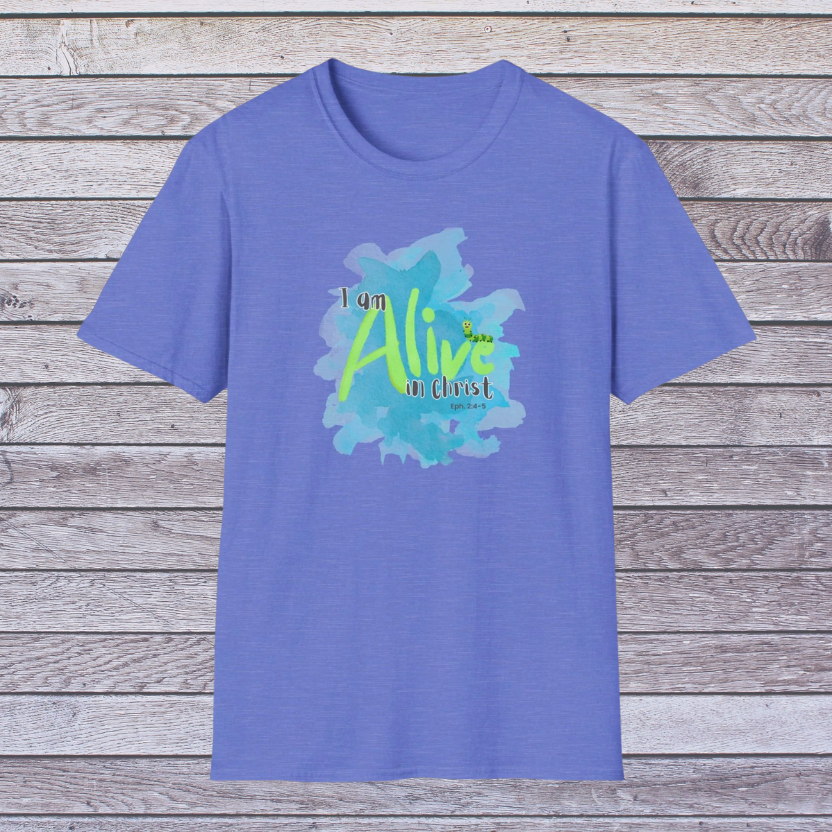 Royal Blue t-shirt with 'I am Alive in Christ' design on a wooden background