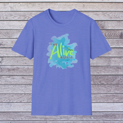 Royal Blue t-shirt with 'I am Alive in Christ' design on a wooden background