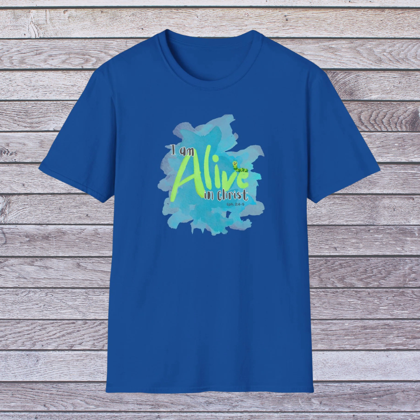 Blue t-shirt with 'I am Alive in Christ' design on a wooden background