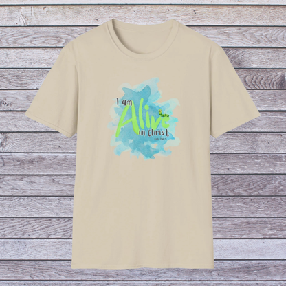 Sand Beige t-shirt with 'I am Alive in Christ' design on a wooden background
