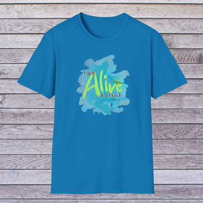 Blue t-shirt with 'I am Alive in Christ' design on a wooden background
