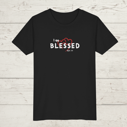 Black t-shirt with 'I am BLESSED' text on a wooden surface