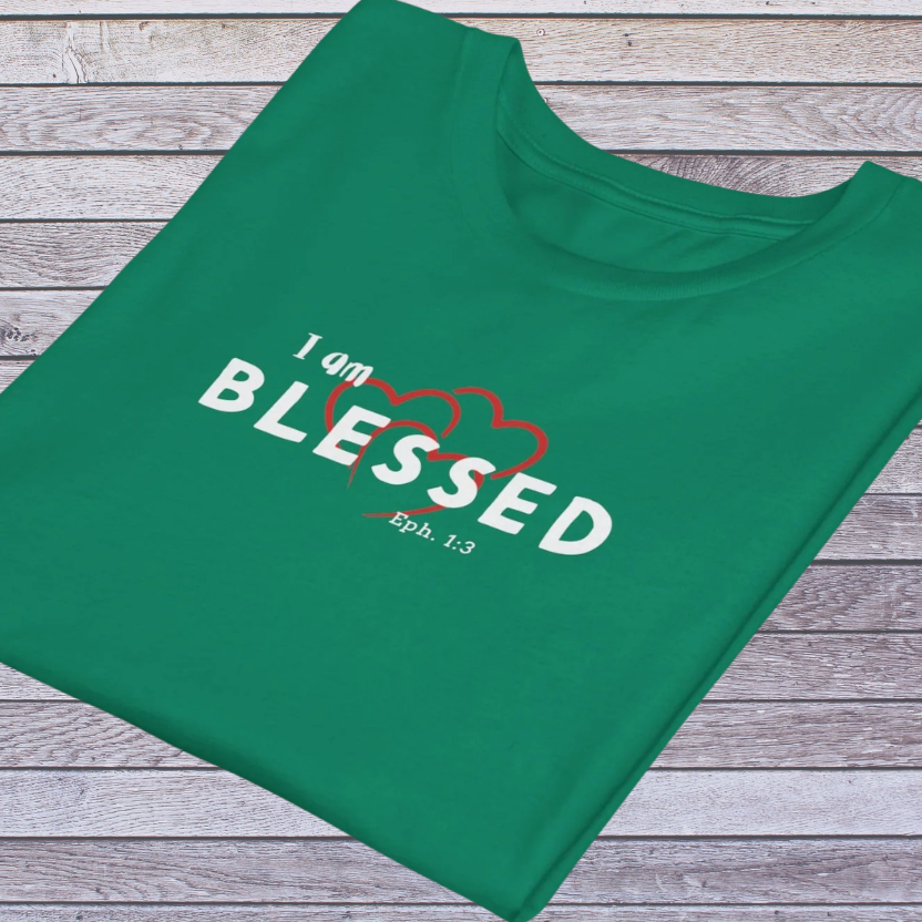 Kelly Green t-shirt with 'I am BLESSED Eph. 1:3' text on a wooden surface