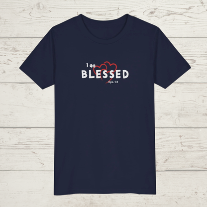 Navy blue t-shirt with 'I am BLESSED' text on a wooden surface