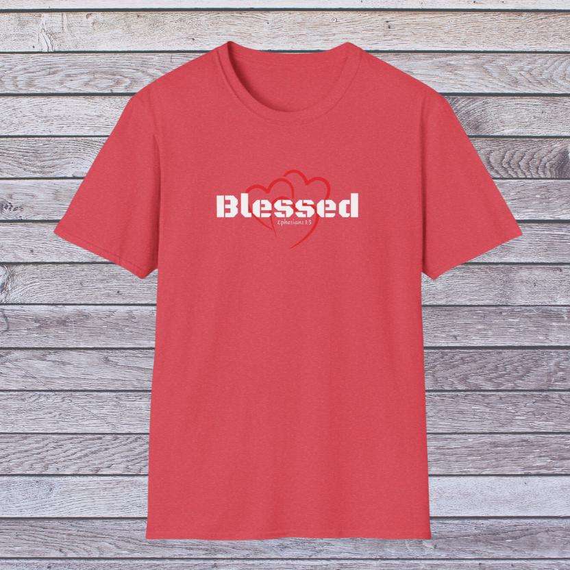 Red t-shirt with 'Blessed' text on a wooden background