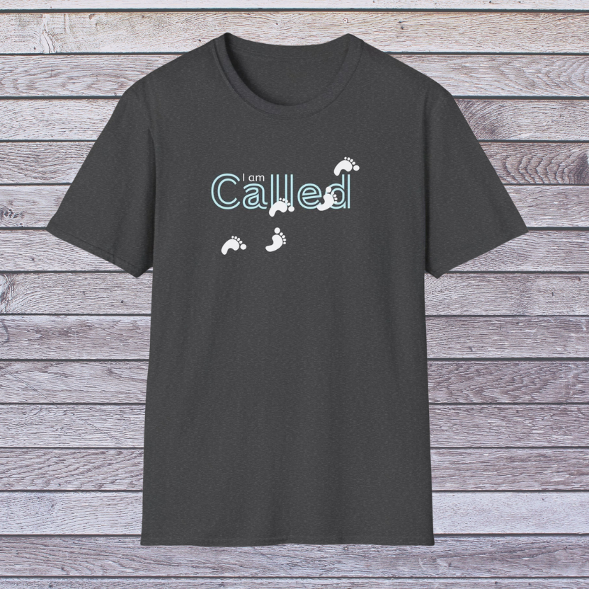 Dark Heather Gray t-shirt with 'I am Called' text and footprints on a wooden background