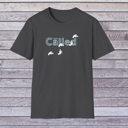 Dark Heather Gray t-shirt with 'I am Called' text and footprints on a wooden background