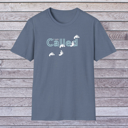 Heather Indigo Gray t-shirt with 'I am Called' text and footprints on a wooden surface
