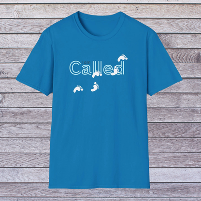 Sapphire Blue t-shirt with 'Called' text and footprints on a wooden background