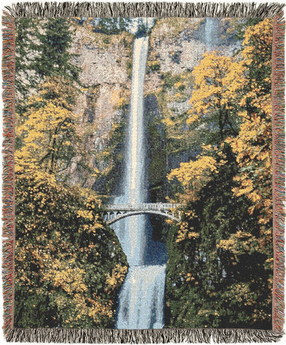 Multnomah Falls woven blanket with a scenic design of a waterfall and bridge surrounded by trees