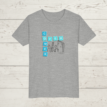 Gray t-shirt with a graphic design 'Overcomer, 1 John 5:4' on a wooden surface