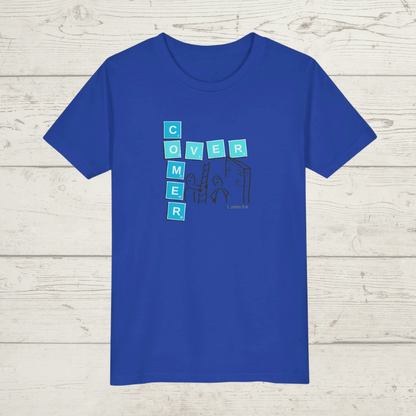 Blue t-shirt with a graphic design 'Overcomer, 1 John 5:4' on a wooden surface