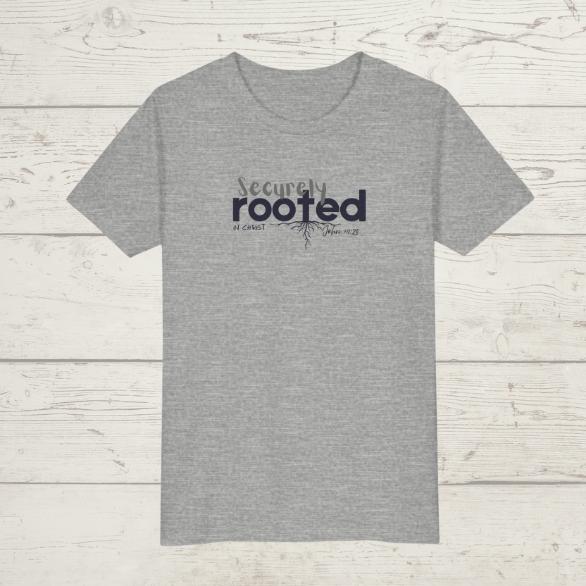 Grey t-shirt with white text 'Securely Rooted' on a wood background