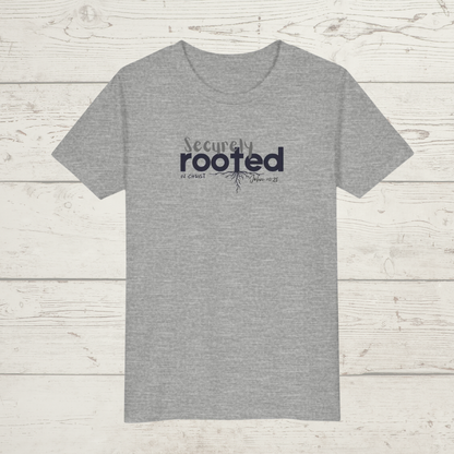 Grey t-shirt with white text 'Securely Rooted' on a wood background