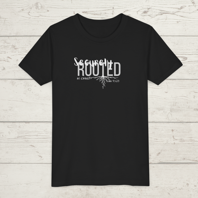 Black t-shirt with white text 'Securely Rooted' on a wood background