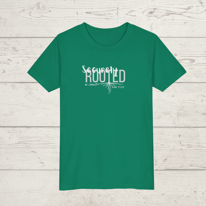 Green t-shirt with white text 'Securely Rooted' on a wooden surface