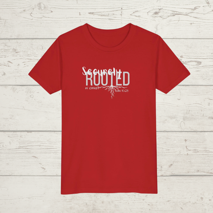 Red t-shirt with white text on a wooden surface