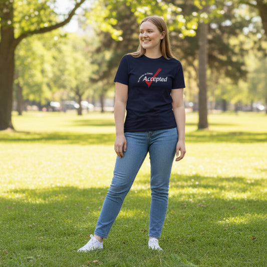 Person wearing a navy blue t-shirt with 'My identity in Christ, accepted' text with a red check mark.