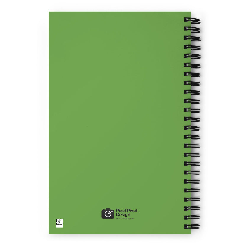 Green notebook with spiral binding on a white background