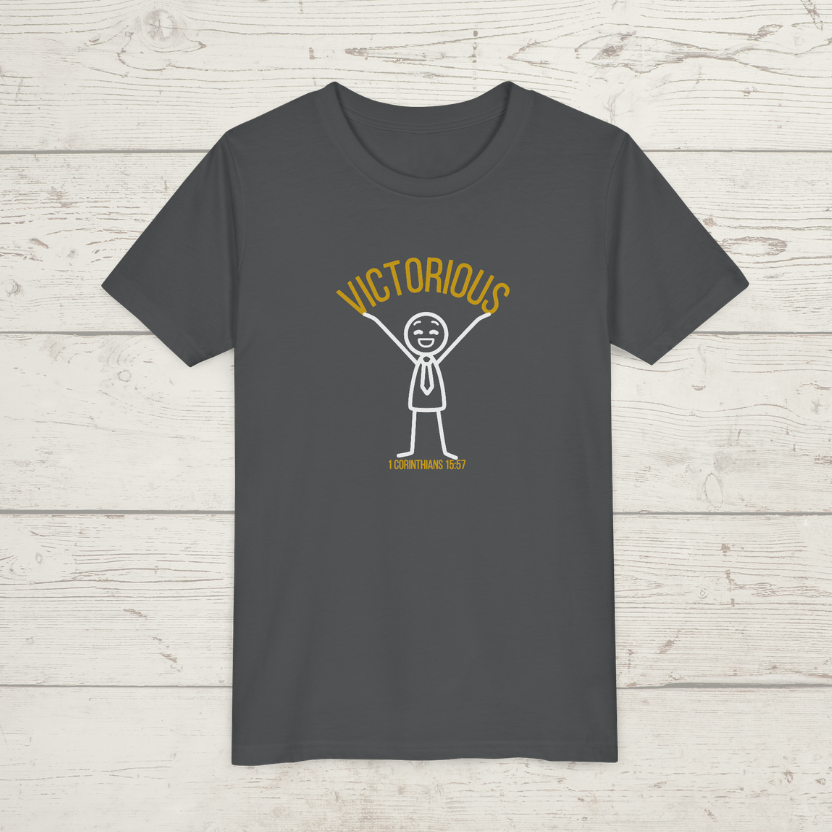 Asphalt gray t-shirt with a graphic design 'Victorious' on a wooden surface