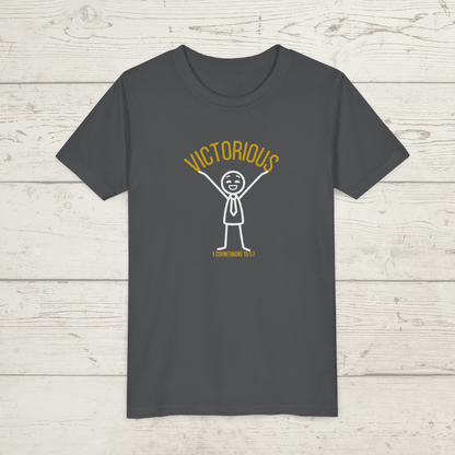Asphalt gray t-shirt with a graphic design 'Victorious' on a wooden surface