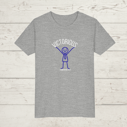 Gray t-shirt with a graphic design "Victorious' on a wooden surface