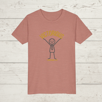 Mauve Pink t-shirt with a graphic design 'Victorious' on a wooden surface