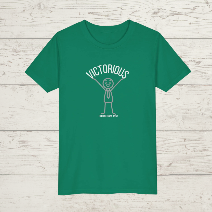 Green t-shirt with white graphic and text on a wooden surface