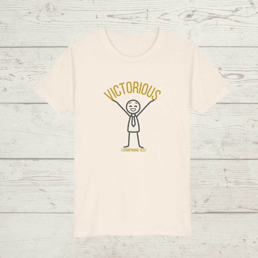 Natural Beige t-shirt with 'Victorious' graphic design on a wooden surface