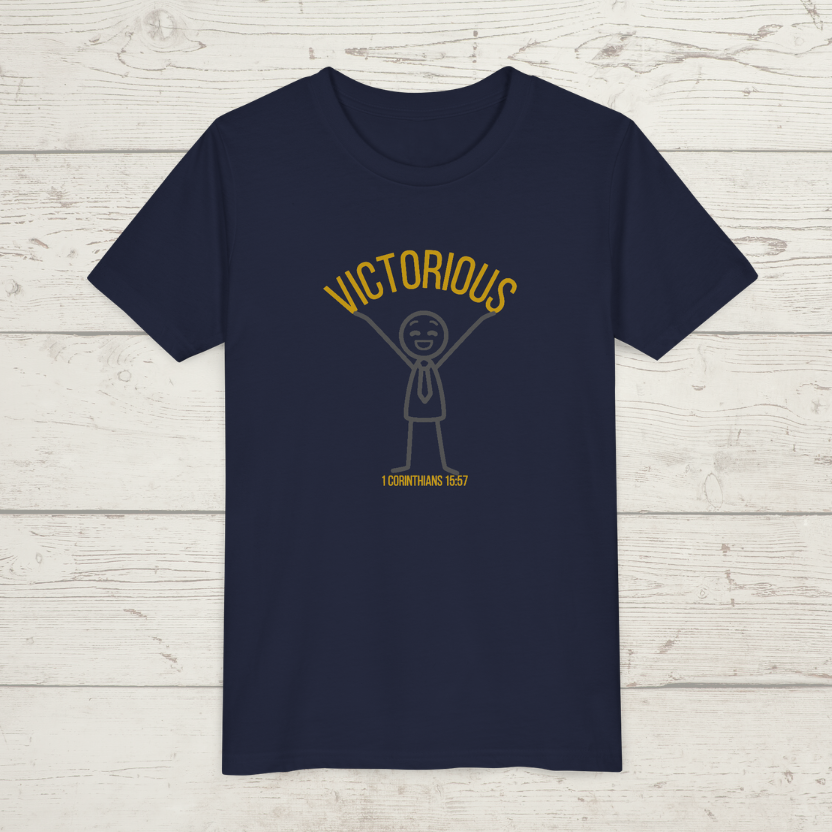 Navy blue t-shirt with 'Victorious' graphic design on a wooden surface