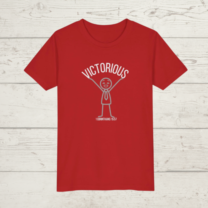 Red t-shirt with 'Victorious' graphic design on a wooden surface