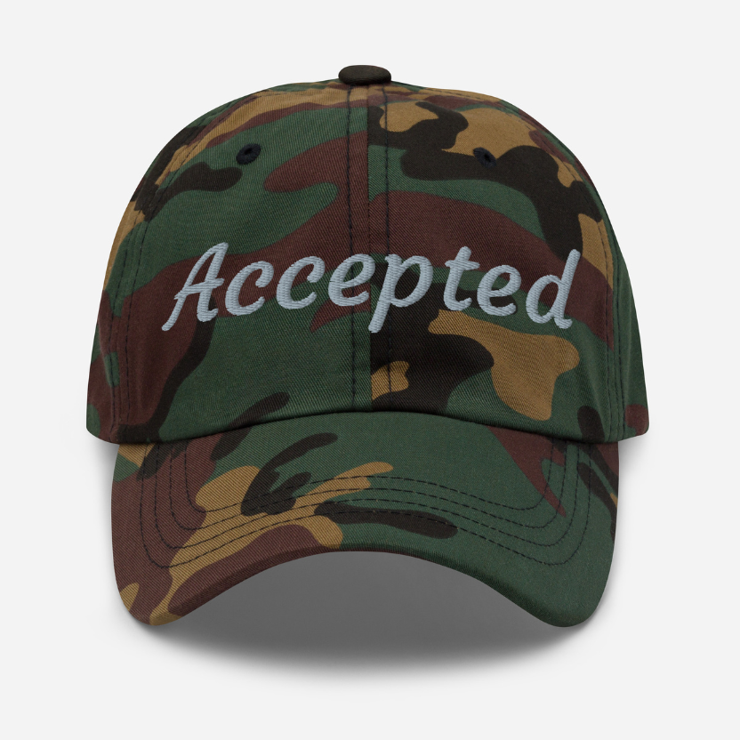 Camouflage cap with 'Accepted' text on a white background