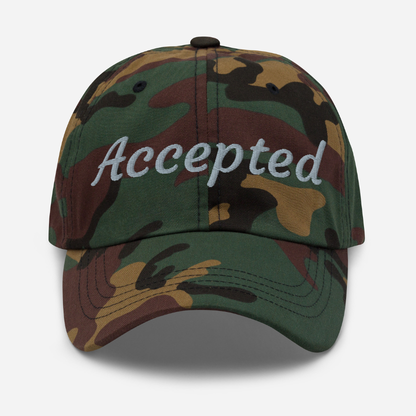 Camouflage cap with 'Accepted' text on a white background