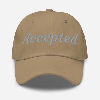 Brown cap with 'Accepted' embroidered on it against a white background