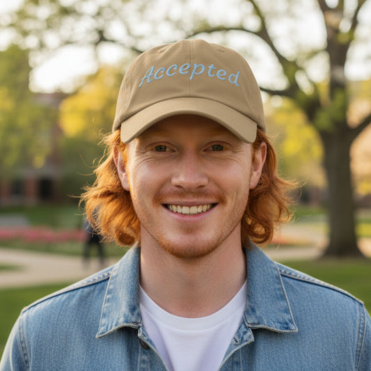 Khaki Brown cap with 'Accepted' embroidered on it, sun shining