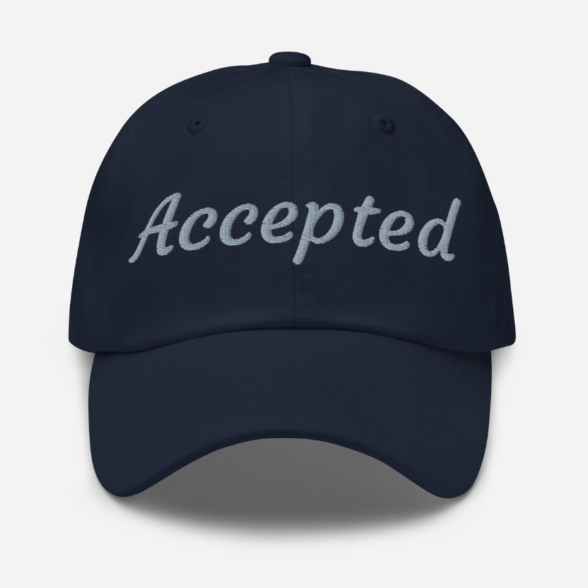 Navy cap with 'Accepted' text on a white background