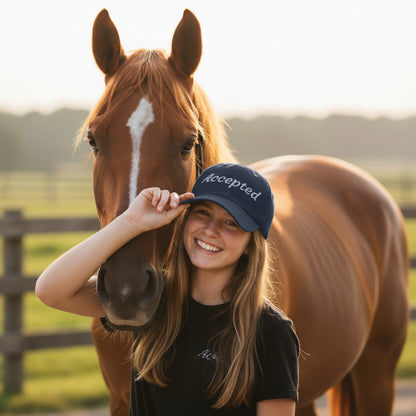 Black cap with 'Accepted' text embroidered, posed with a brown horse