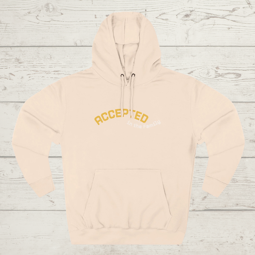 Pale Pink hoodie with 'ACCEPTED' text on a wooden surface