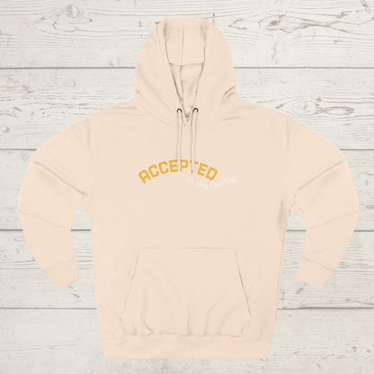 Pale Pink hoodie with 'ACCEPTED' text on a wooden surface