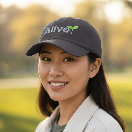 Black cap with 'Alive' text and green leaf design
