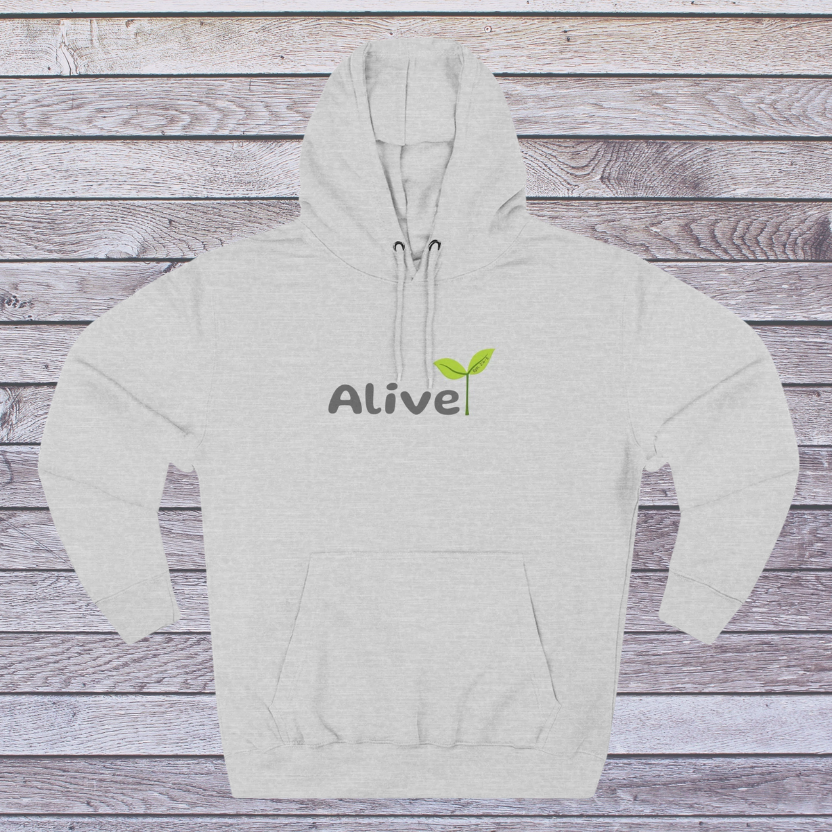 Grey hoodie with 'Alive' logo on a wooden background