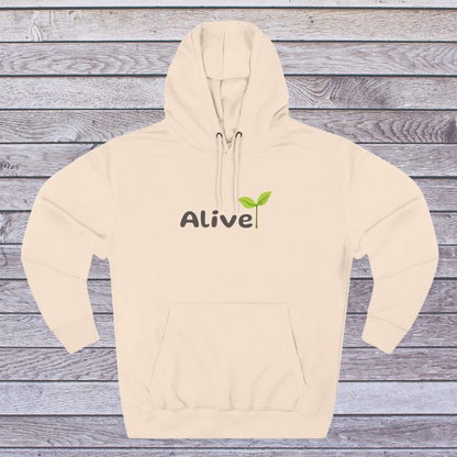 Pale Pink hoodie with 'Alive' text and green leaf graphic on a wooden background