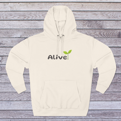 Sandshell Beige hoodie with 'Alive' logo on a wooden surface