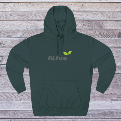 Green hoodie with 'Alive' logo on a wooden surface