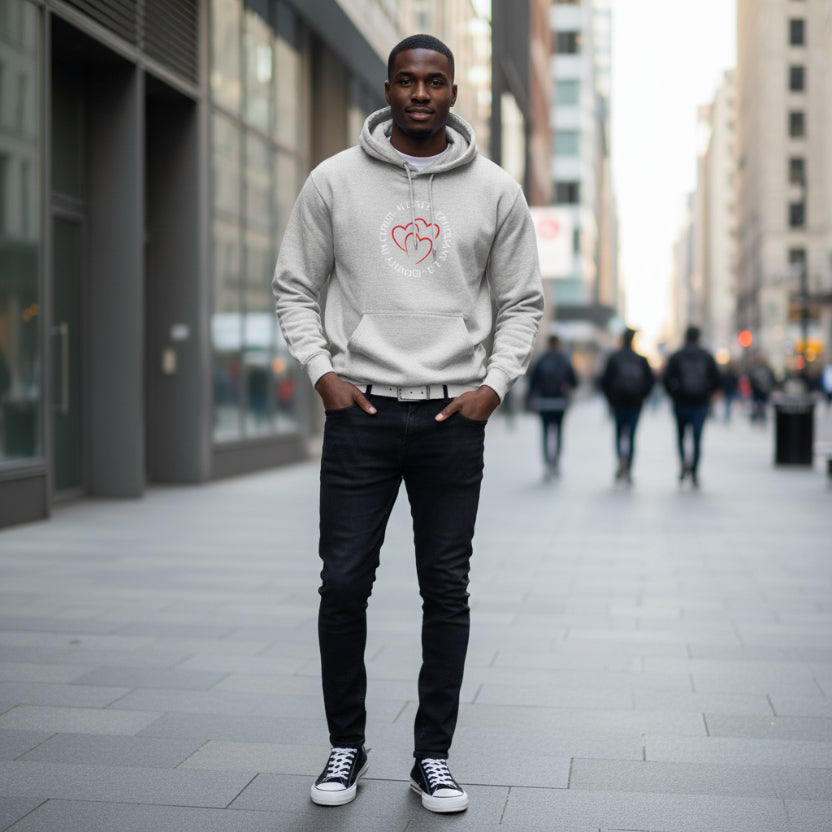 Gray hoodie with 'Blessed, Identity in Christ, Ephesians 1:3' logo, black jeans, and black sneakers in the city