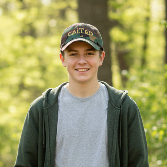 Camouflage baseball cap with 'I am CALLED' text, unisex cap, standing outside